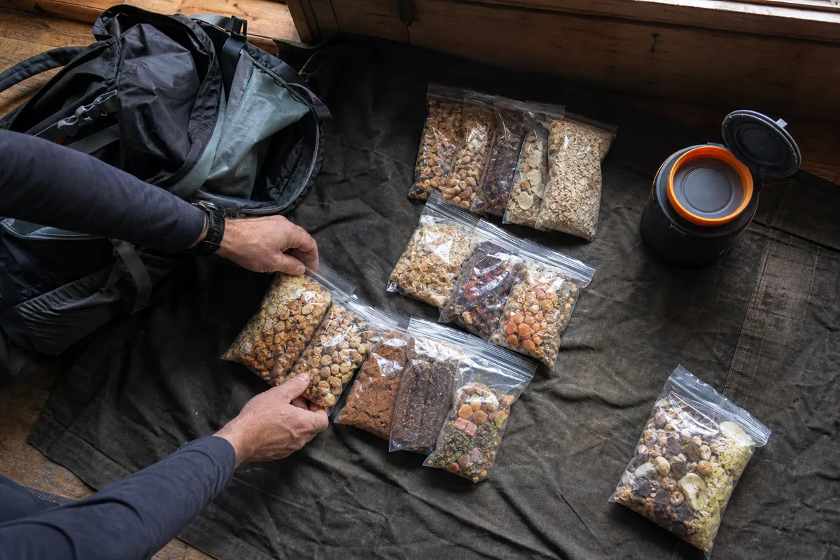 Trek food divided into separate daily bags with breakfast, trail portions, dinner, and reserve - daily trek food packing | KnowOutdoor